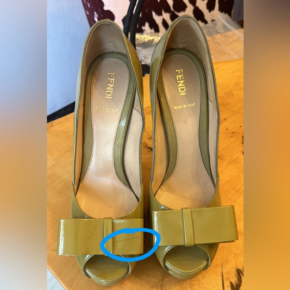 Fendi pumps in brand new conditions with some stains shown and price reflected.